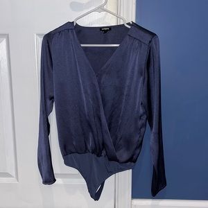 Shiny blue long sleeve body suit.